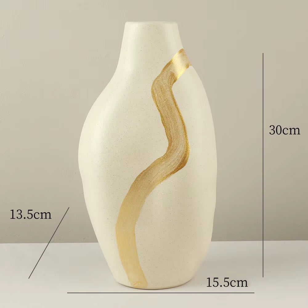 White vase with gold accents and measurements on a gray background