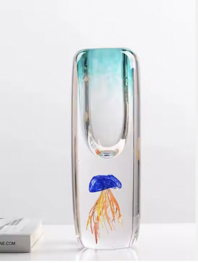Glass vase with a jellyfish design on a white background