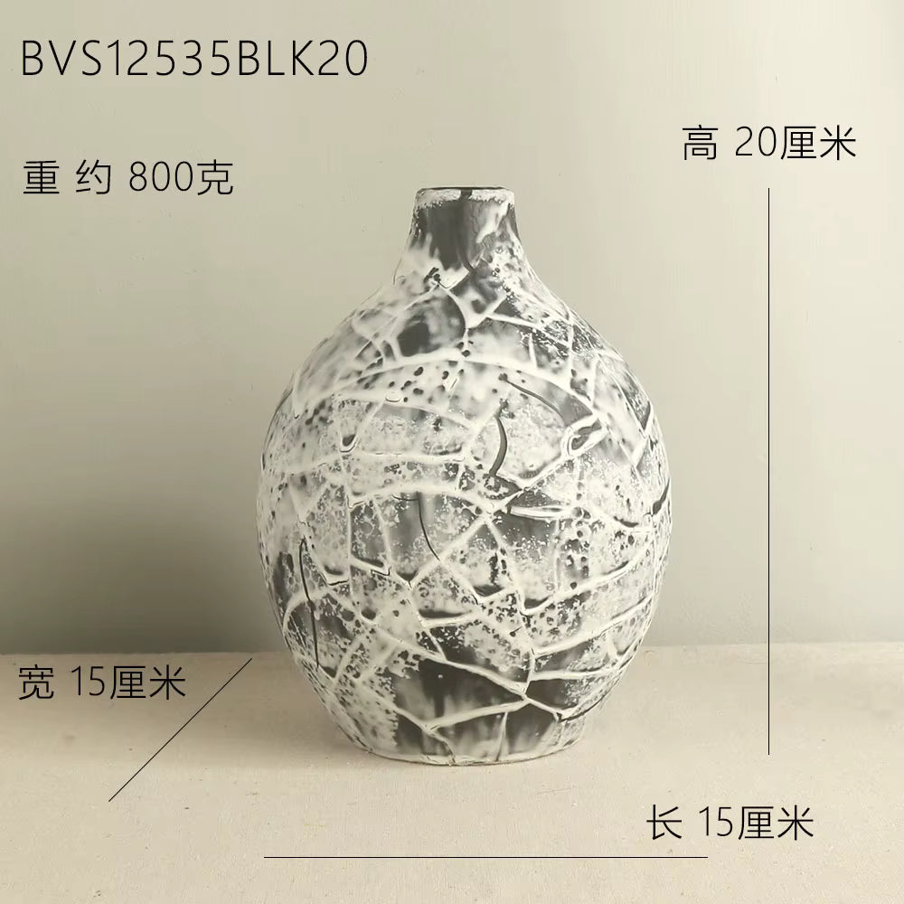 Decorative vase with cracked texture on a plain background