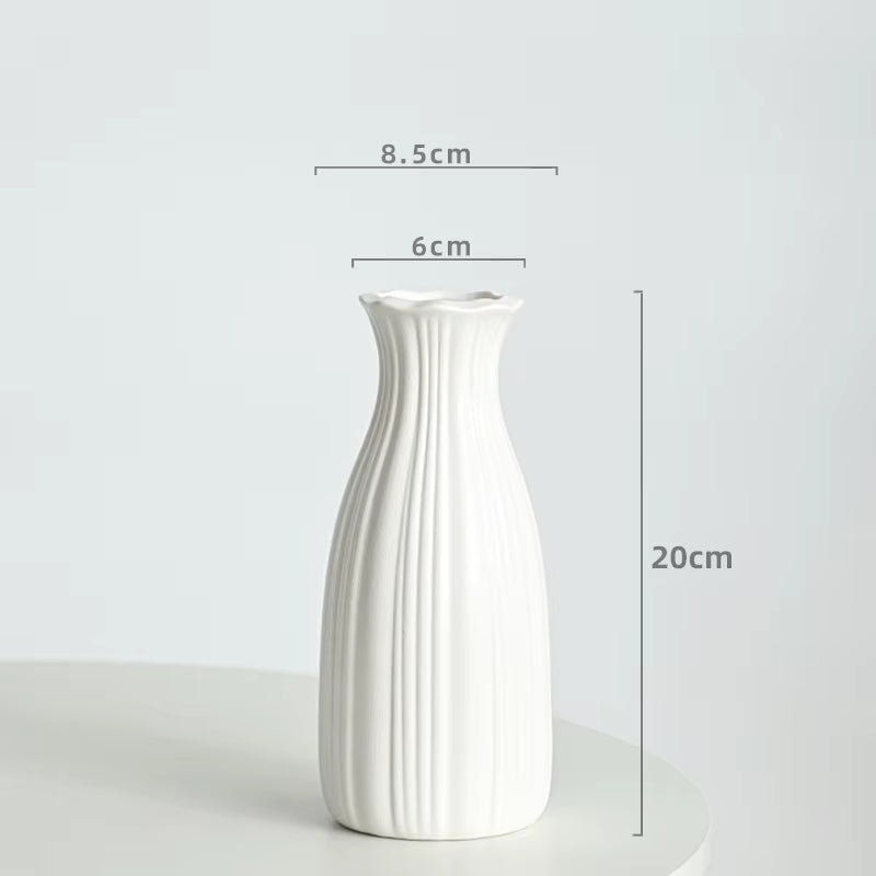 White ceramic vase with dimensions on a light gray background