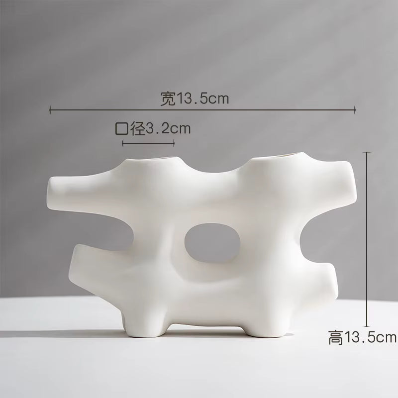 White abstract vase with dimensions indicated on a gray background