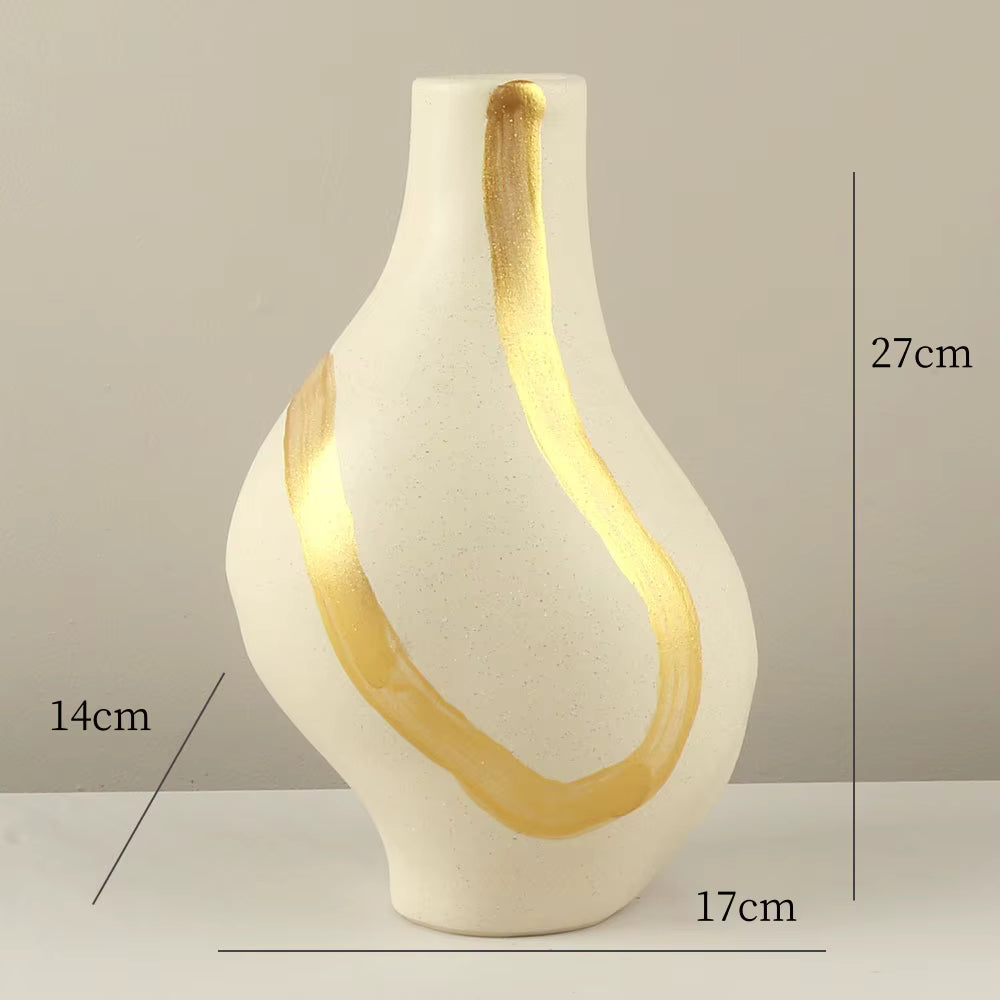 White vase with gold accents and measurements on a neutral background