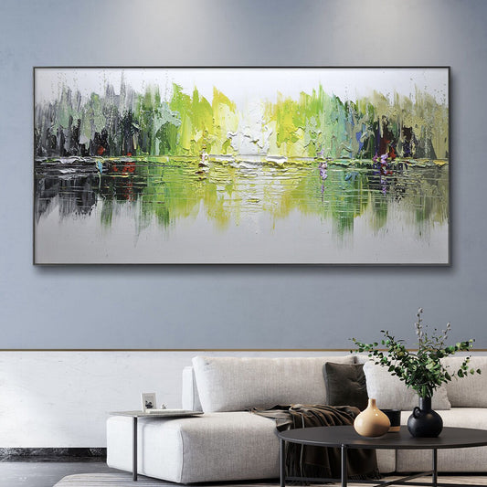 Abstract painting of a landscape with green and yellow tones on a gray wall above a sofa.