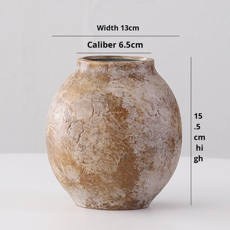 Brown ceramic vase with measurements on a light gray background