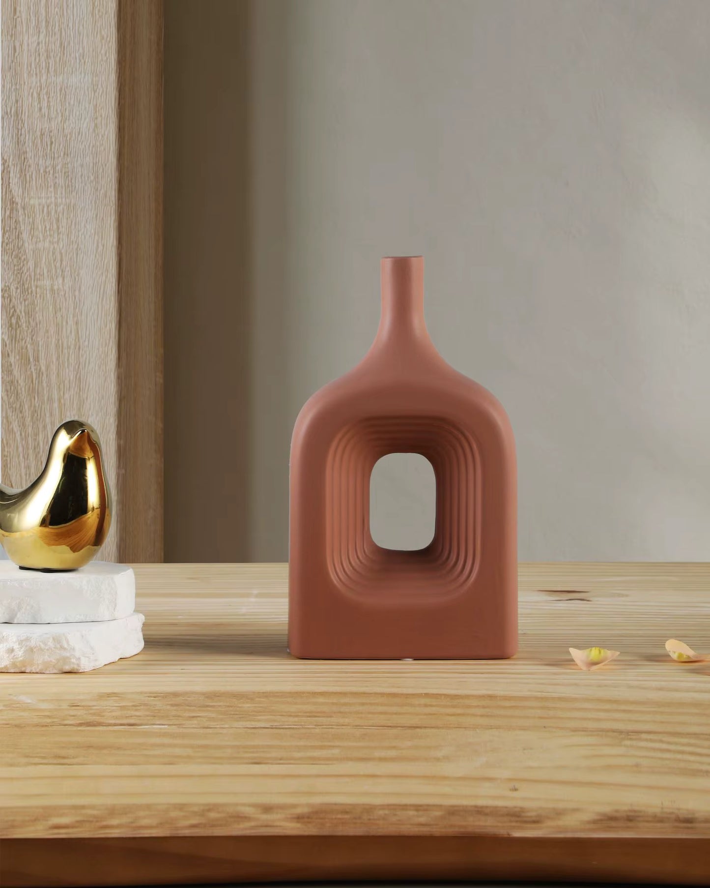Decorative vase with unique design on a wooden surface