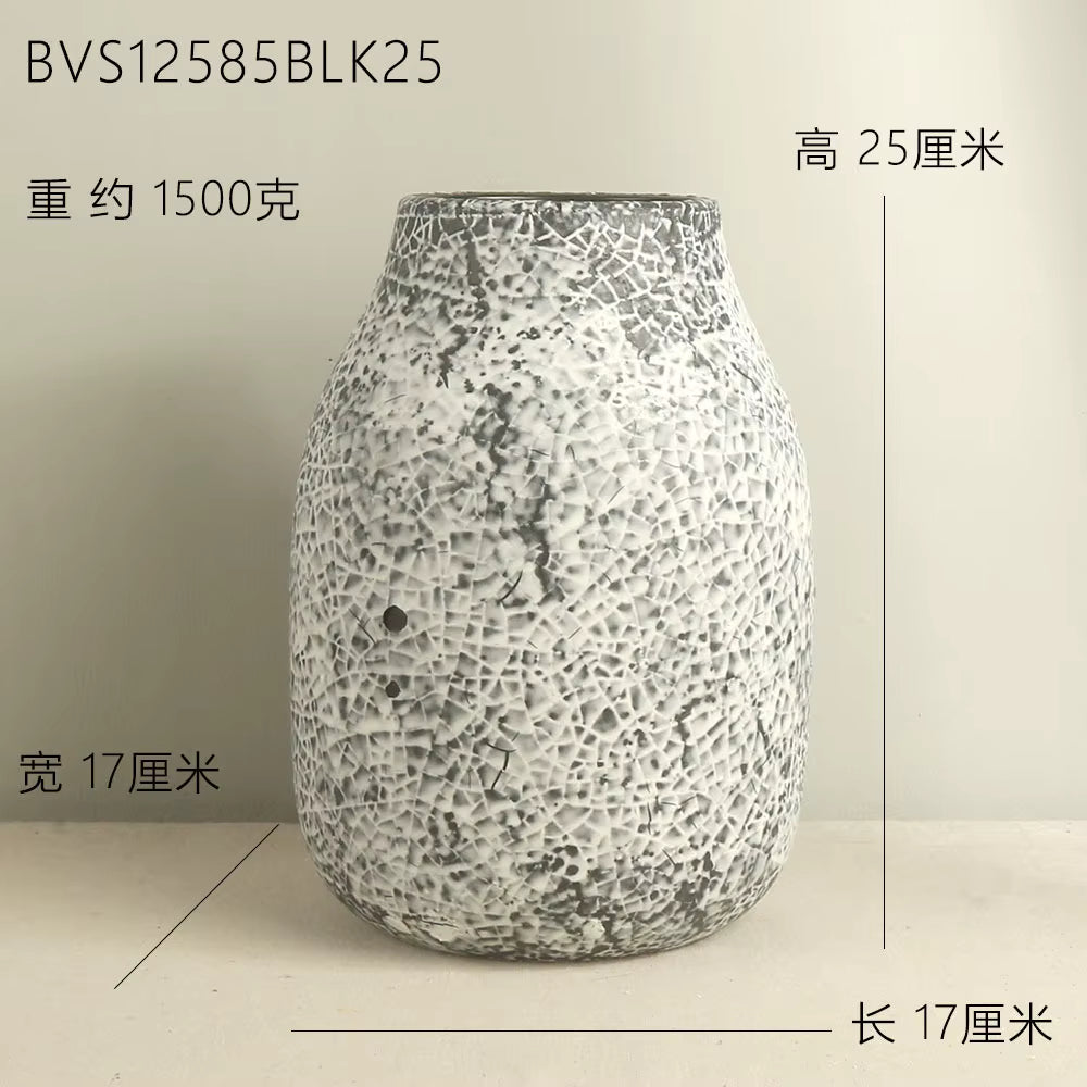 Decorative vase with textured surface on a plain background