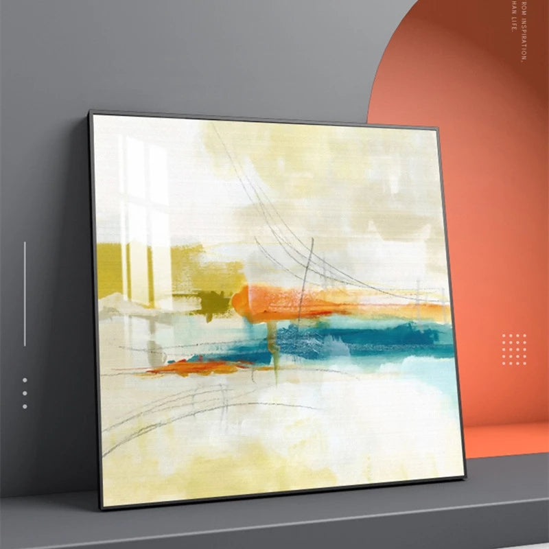 Abstract art painting with orange and blue elements on a gray wall.