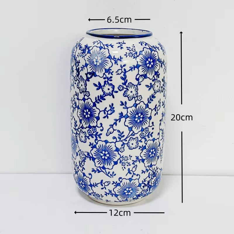 Ceramic vase with blue floral patterns and measurements on a white background