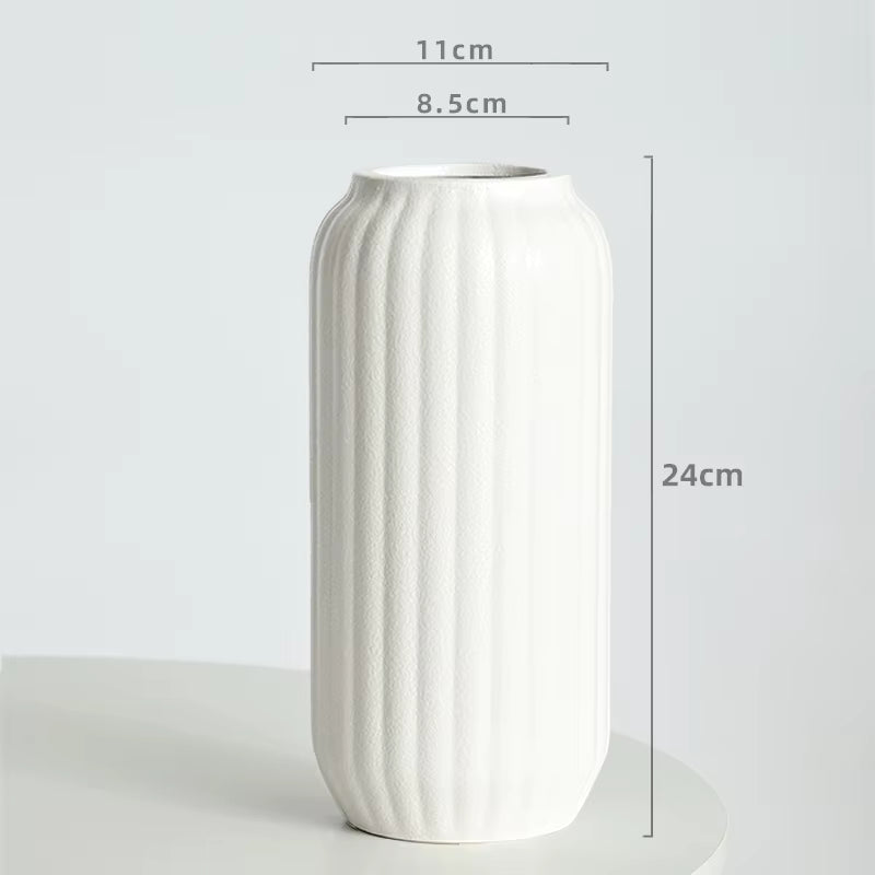 White textured vase with dimensions on a light gray background