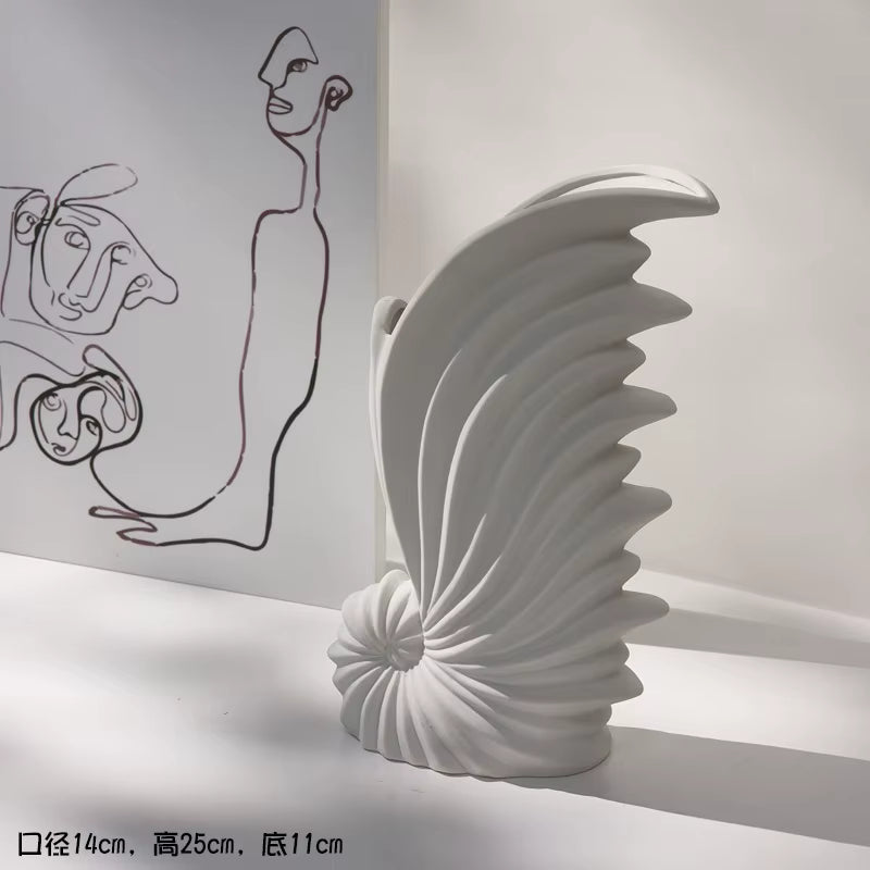 White, abstract sculpture on a white surface with artistic background