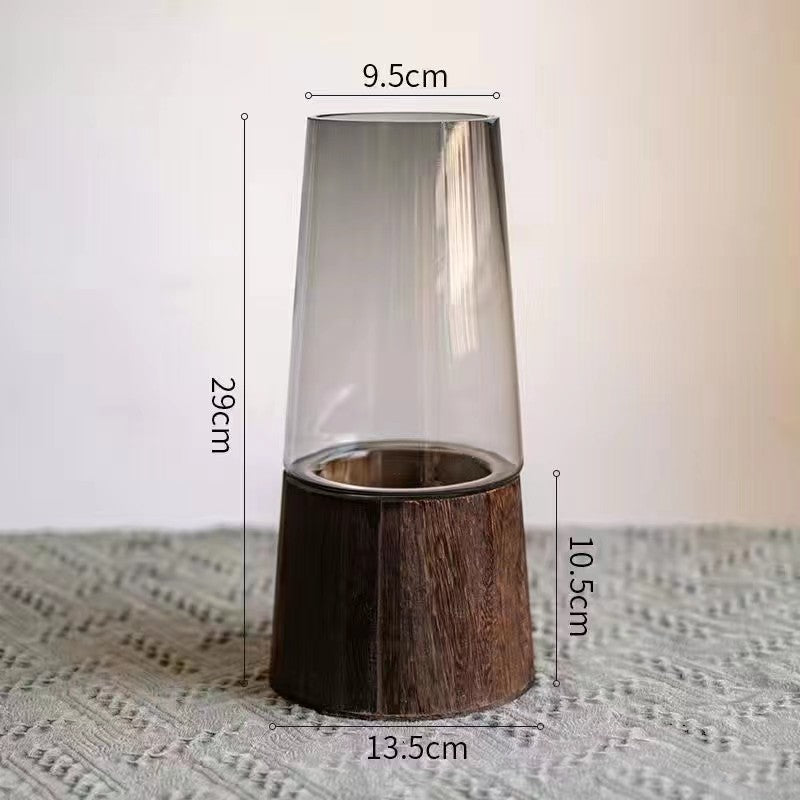 Votive candle holder with wooden base and glass cover, shown with measurements on a textured surface.