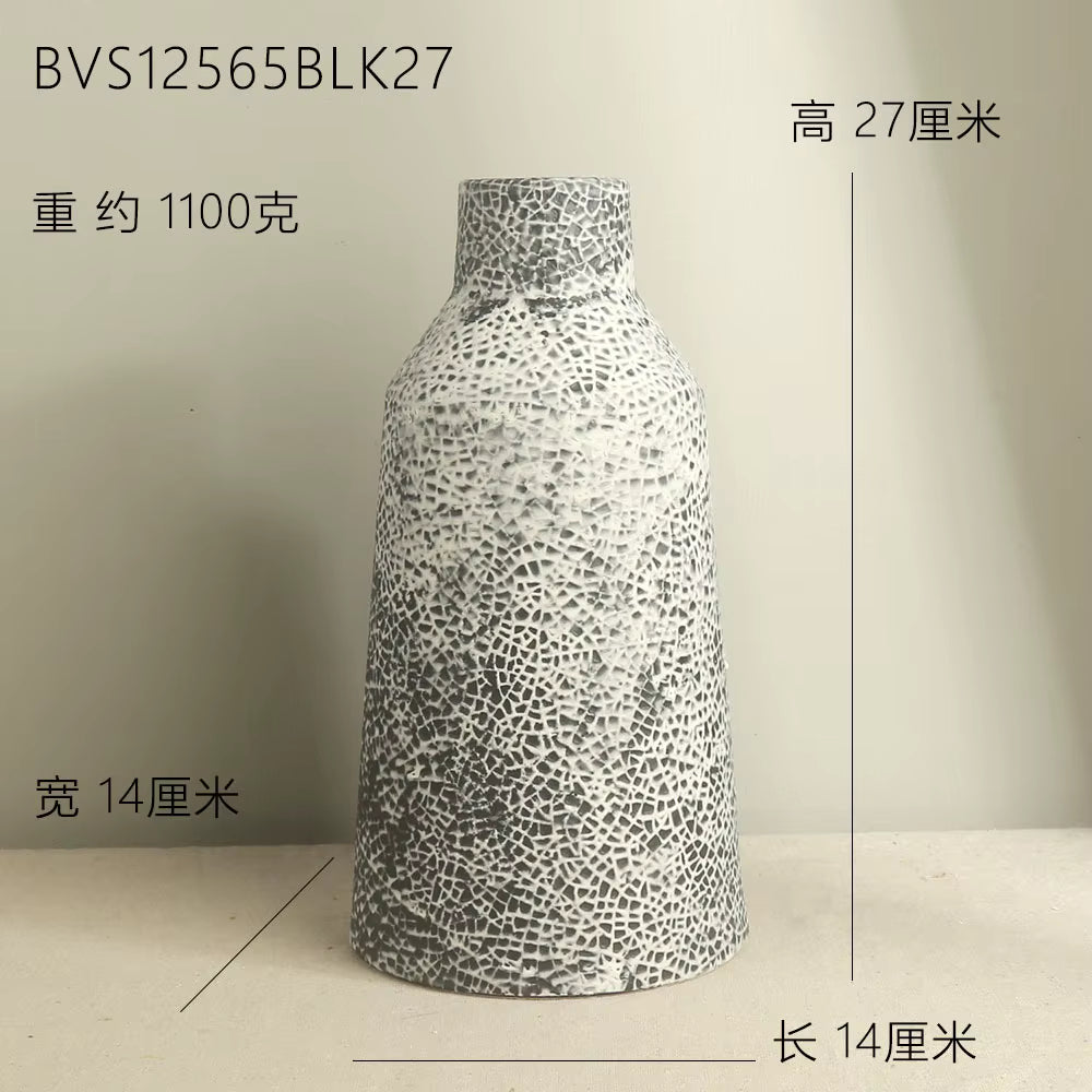 Decorative vase with textured design on a plain background