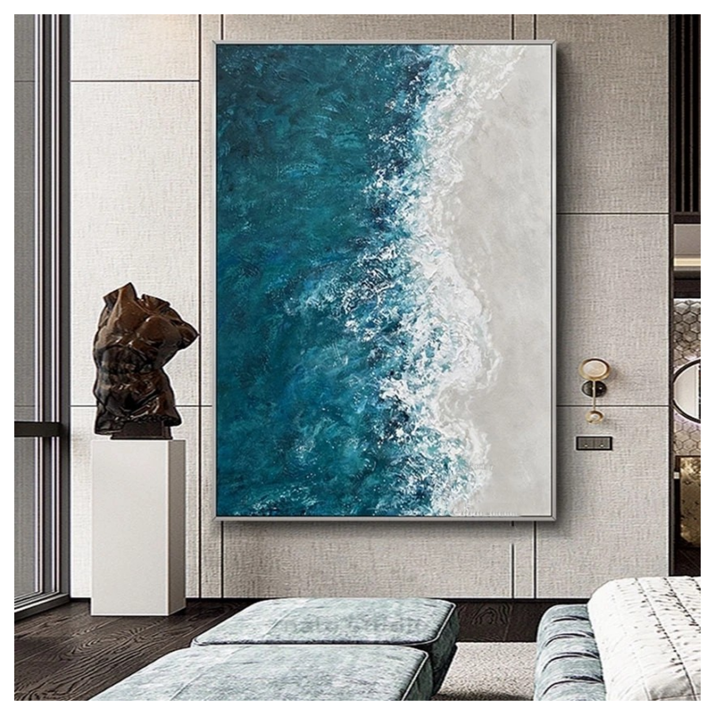 Large abstract painting of blue and white waves on a wall in a modern interior setting.