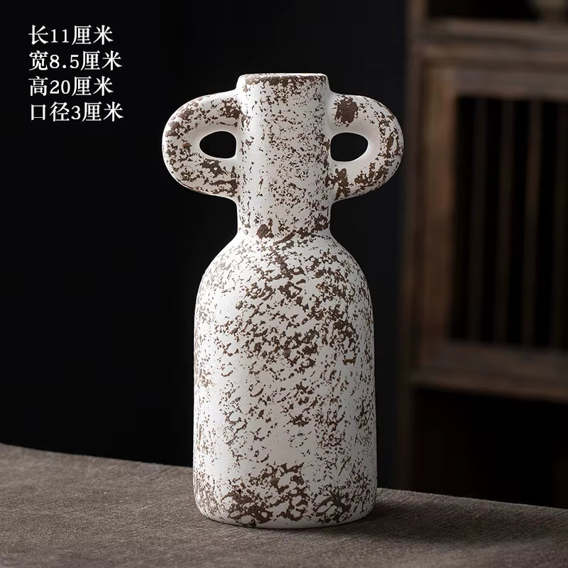 Decorative ceramic vase with unique design on a dark background