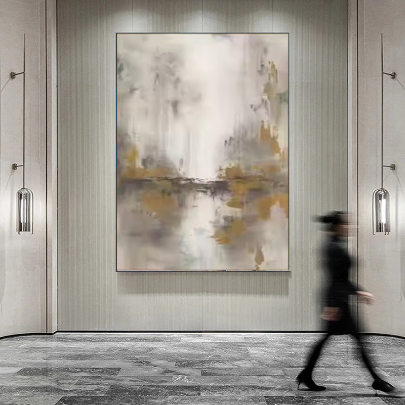 Abstract art painting in a modern interior setting with a person walking by.