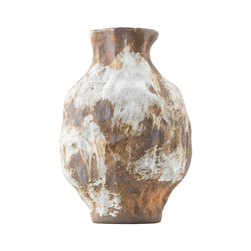 Ceramic vase with brown and white marbled pattern on a white background