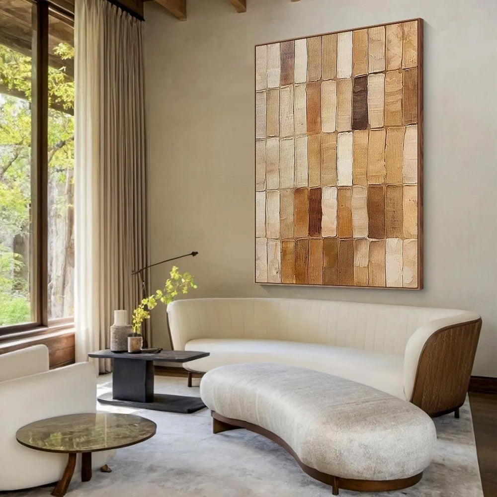Modern living room with a beige sofa, coffee table, and decorative wall art.