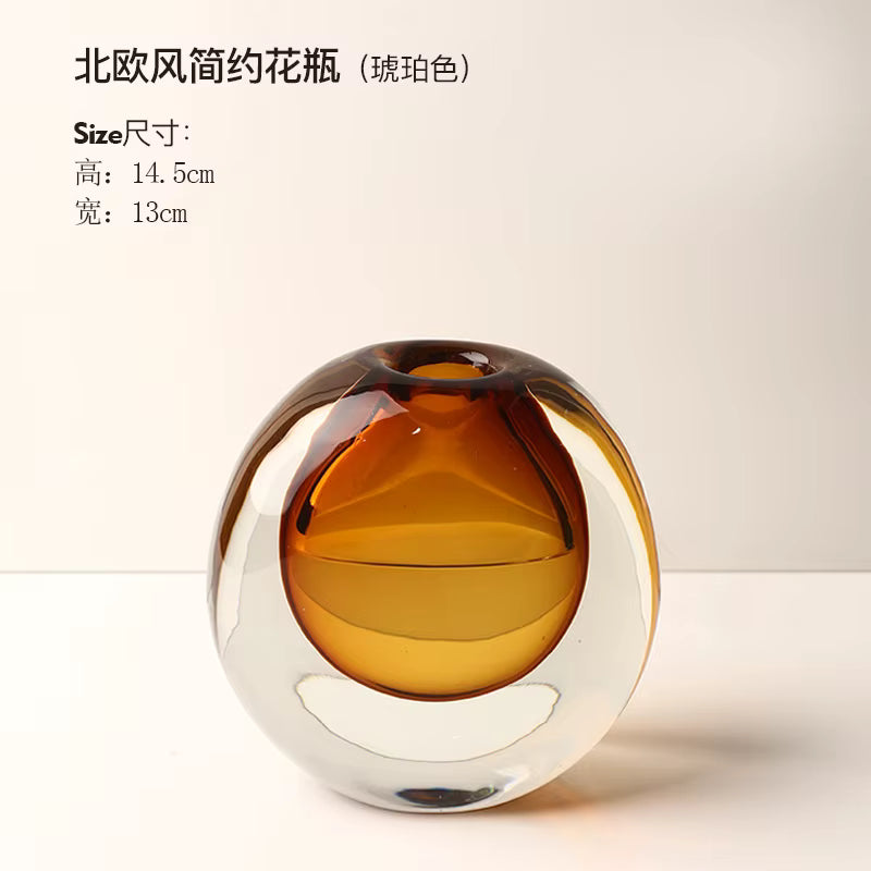 Glass vase with amber and clear design on a light background