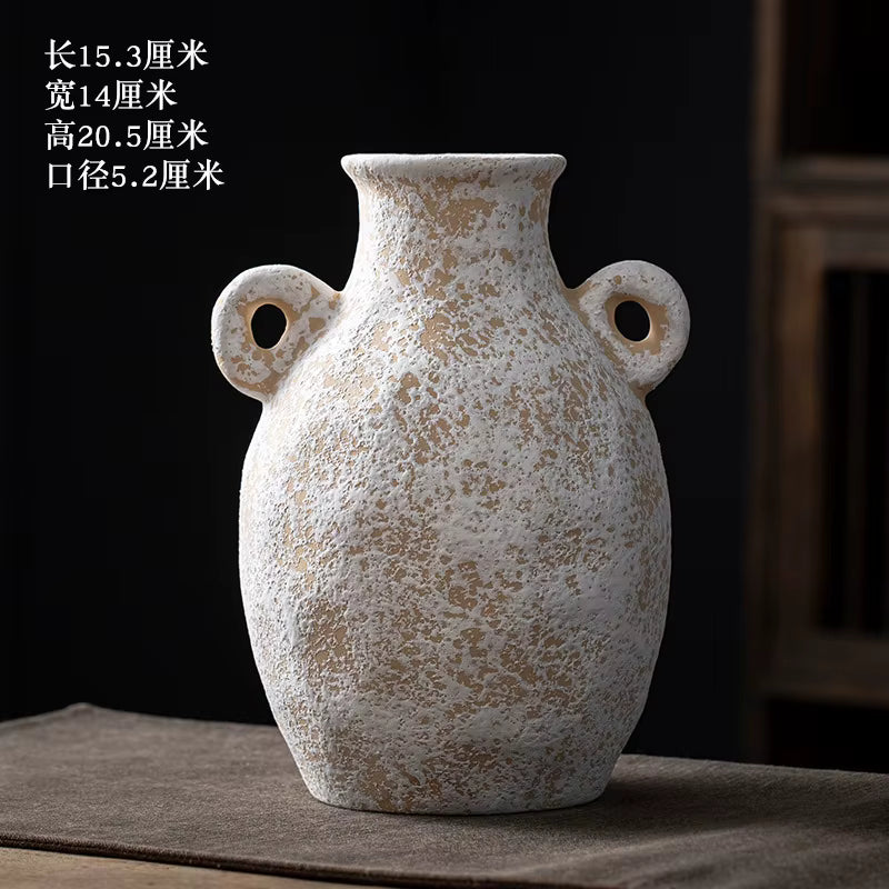 Decorative ceramic vase with textured surface on a dark background