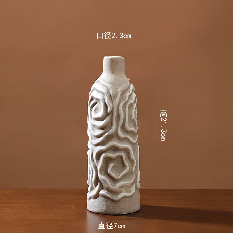 Decorative ceramic vase with textured design on a brown background