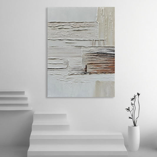 Abstract painting on a white wall with a minimalistic interior design.