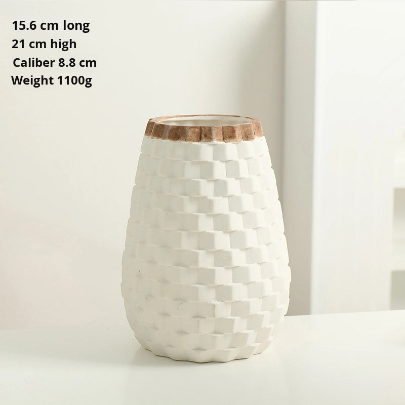 White geometric-patterned vase with wooden top on a white background