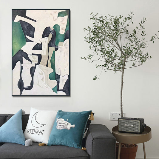 Living room with abstract art, cushions, and a plant