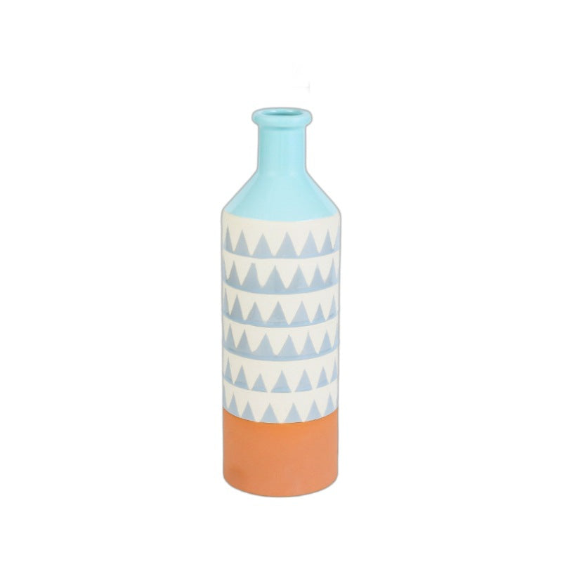 Decorative vase with blue and orange design on a white background