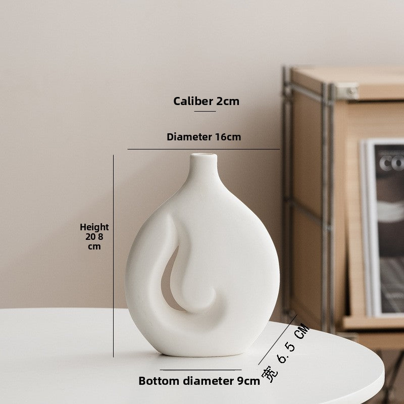 White vase with measurements on a neutral background