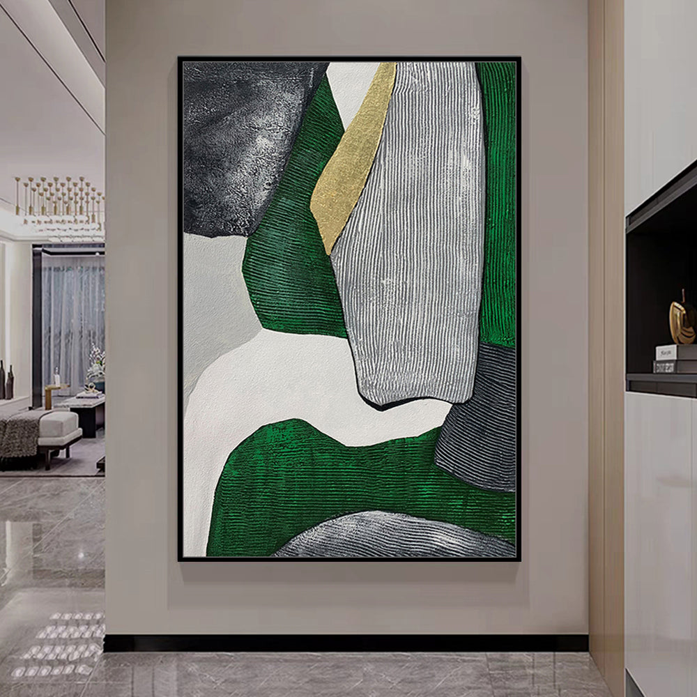 Abstract art piece with green, gray, and white colors in a modern interior setting.