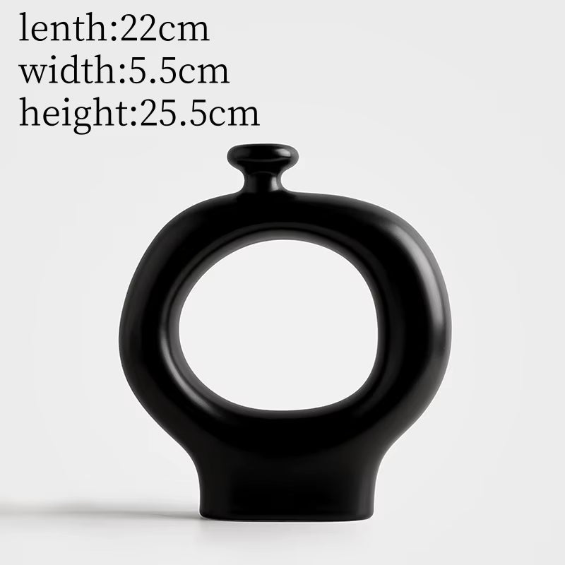 Black vase with measurements on a white background
