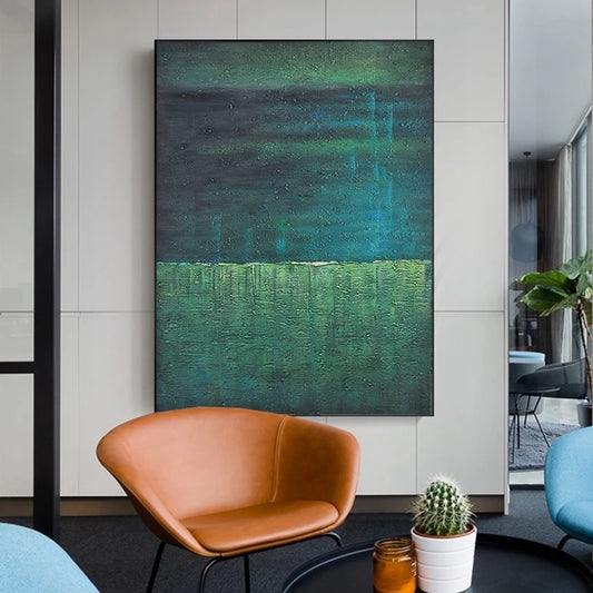 Modern interior with a large abstract painting, brown chair, and cactus plant.