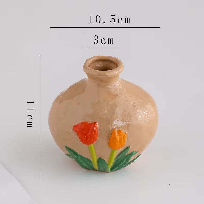 Ceramic vase with tulip designs and measurements on a white background