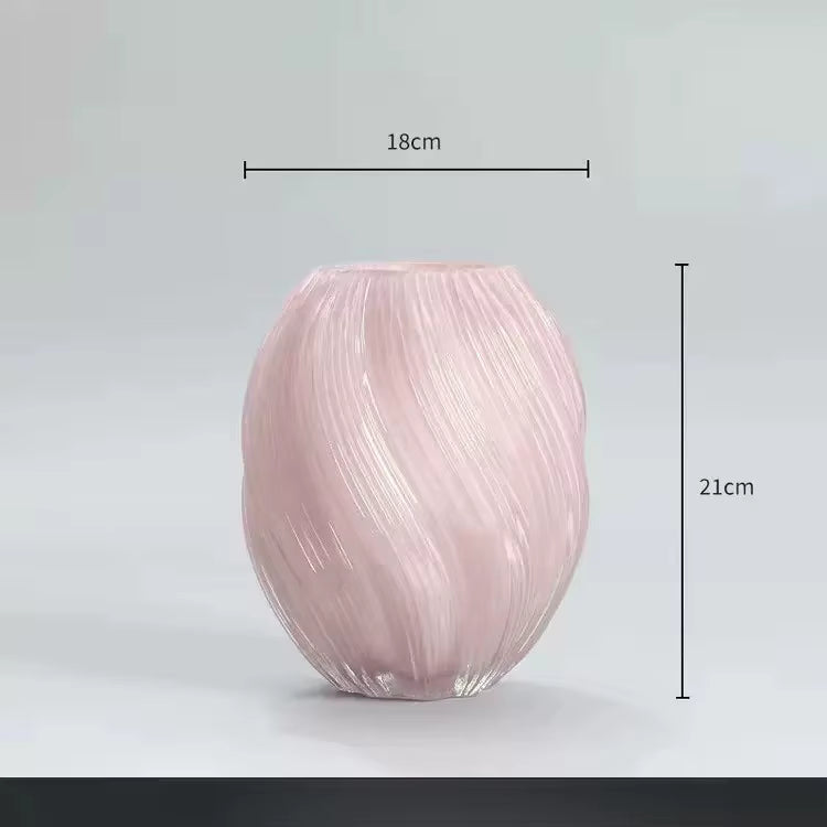 Pink glass vase with measurements on a light gray background