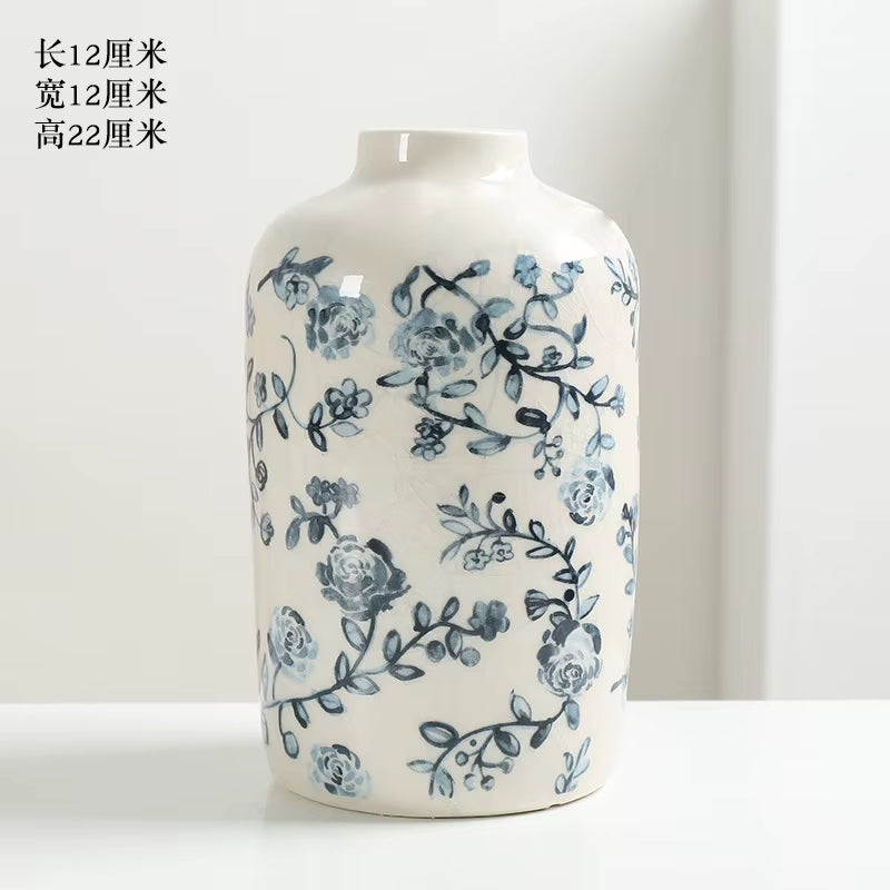 White vase with blue floral patterns on a white background