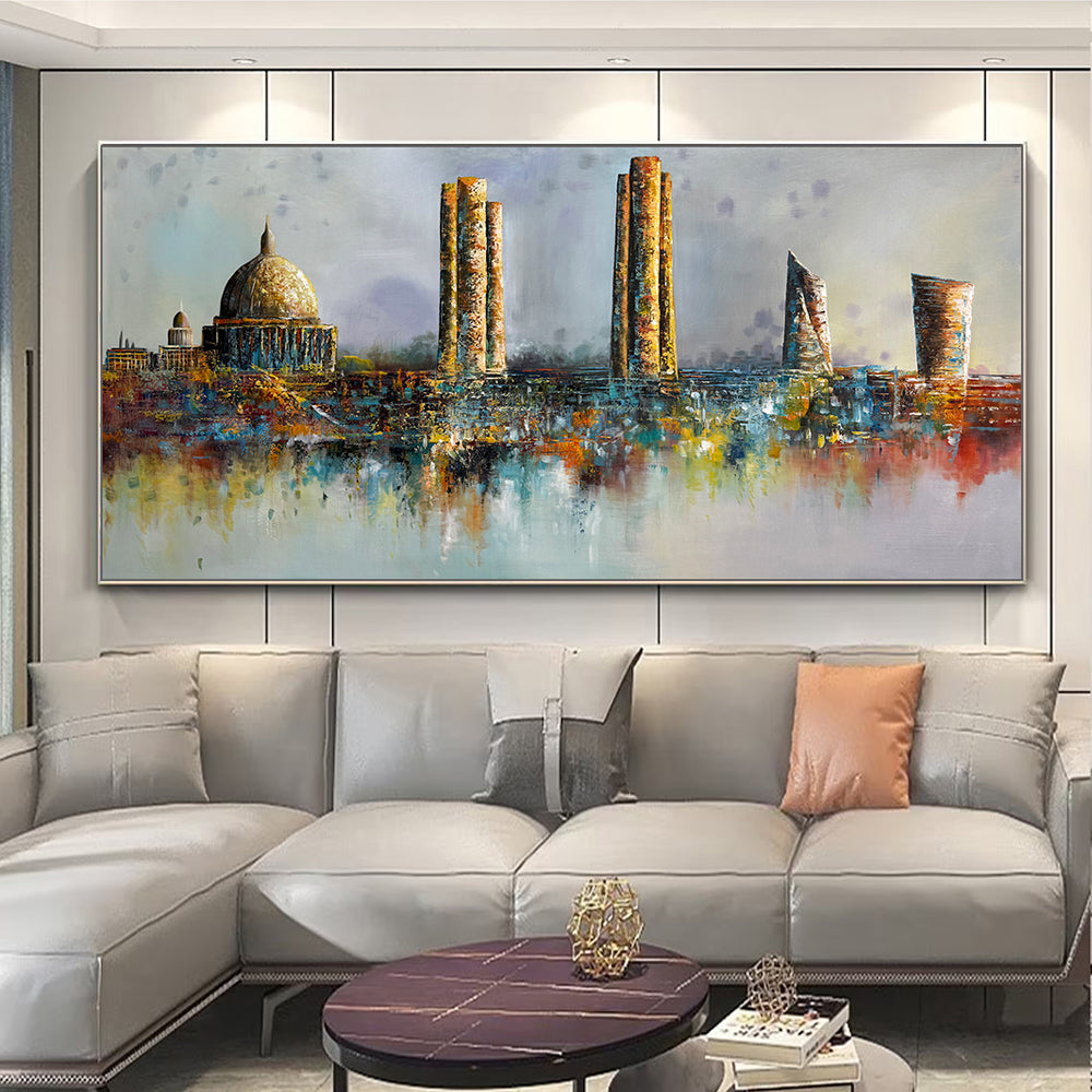 Colorful cityscape painting on a wall above a gray sofa.