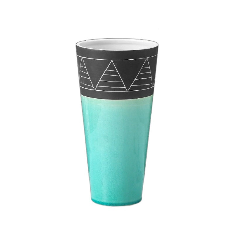Turquoise tumbler with black band featuring white geometric design on a white background
