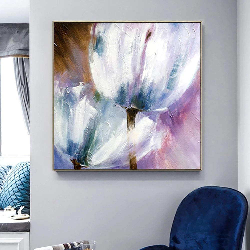 Abstract painting on a wall with a blue chair and window in the background