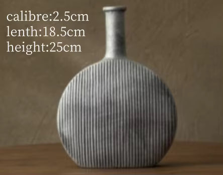 Textured vase on a wooden surface with measurements displayed