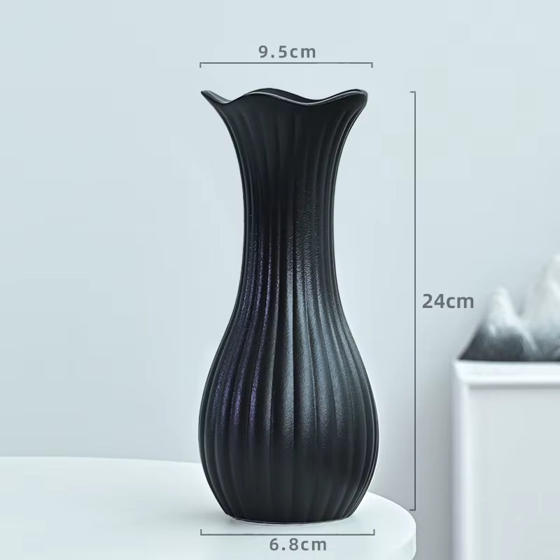 Black vase with dimensions on a light gray background