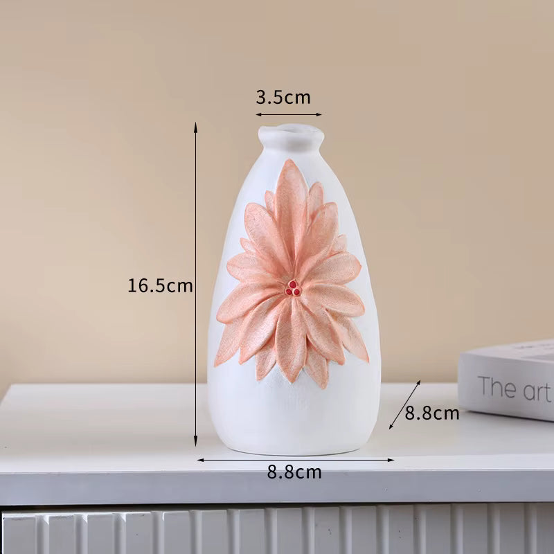 White vase with a pink floral design on a beige background, showing measurements.