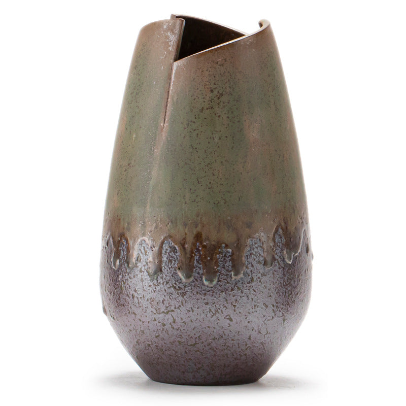 Decorative ceramic vase with a textured surface on a white background