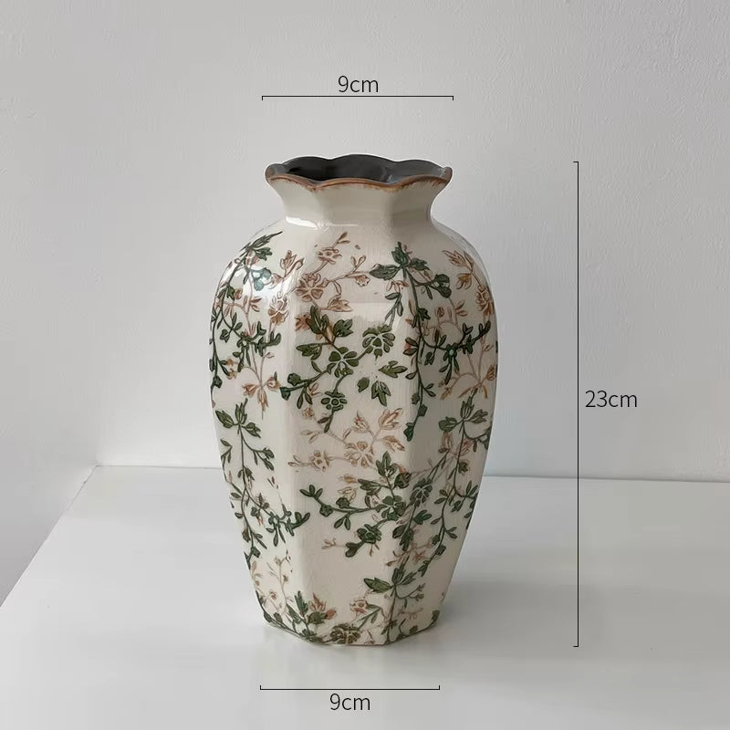 Decorative vase with floral patterns and measurements on a white background