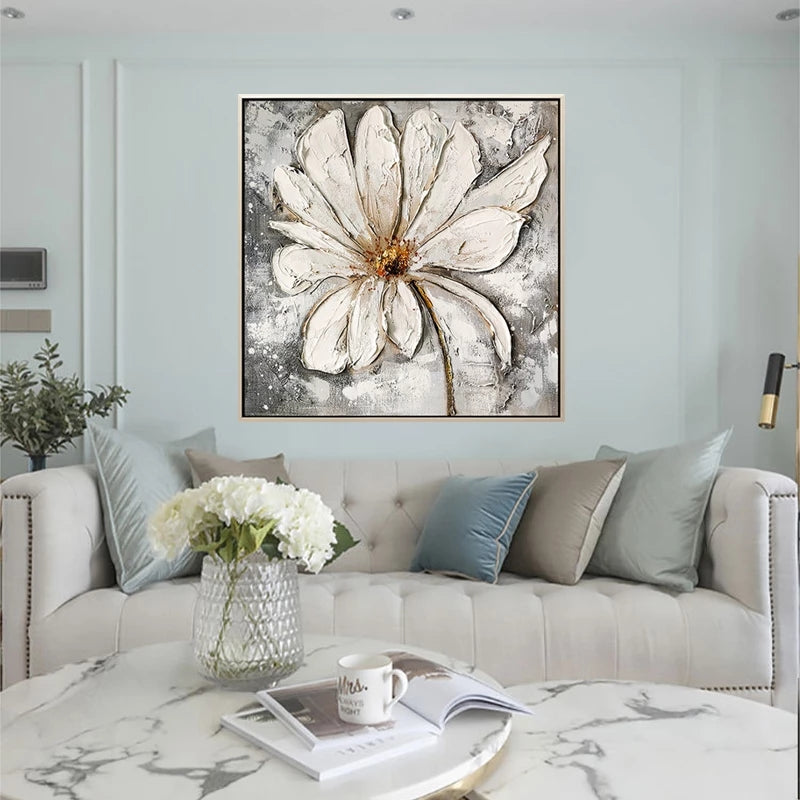 Living room with a large abstract flower painting on the wall above a sofa.