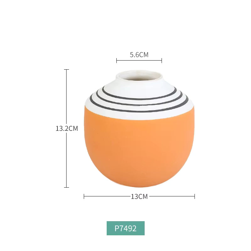 Orange and white striped vase with measurements on a white background
