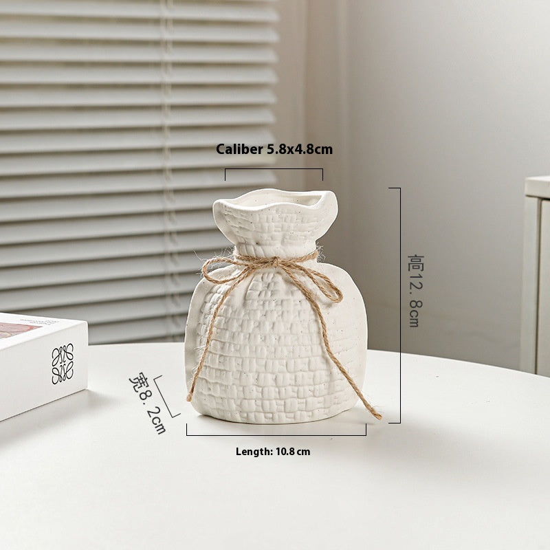 White textured diffuser with twine on a light surface, with measurements displayed.