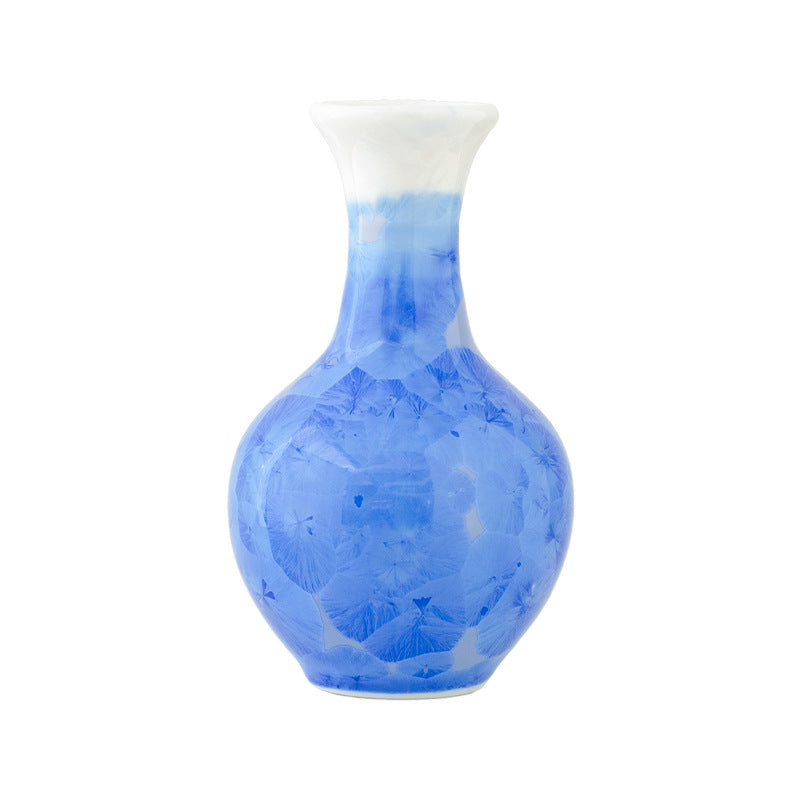 Blue and white ceramic vase on a white background