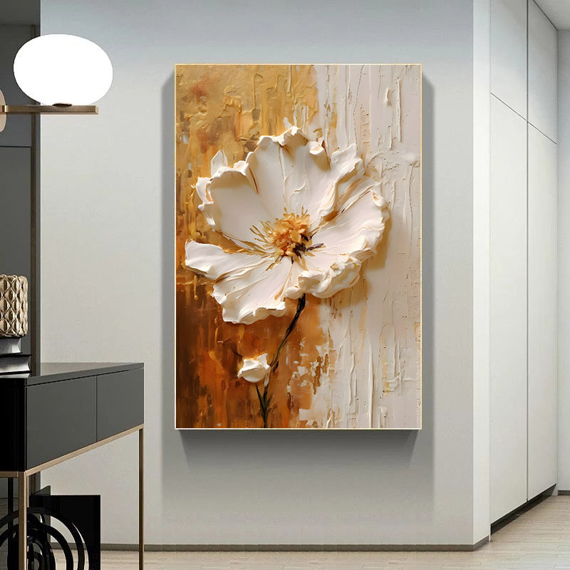 Abstract painting of a white flower on a textured gold and beige background in a modern interior setting.