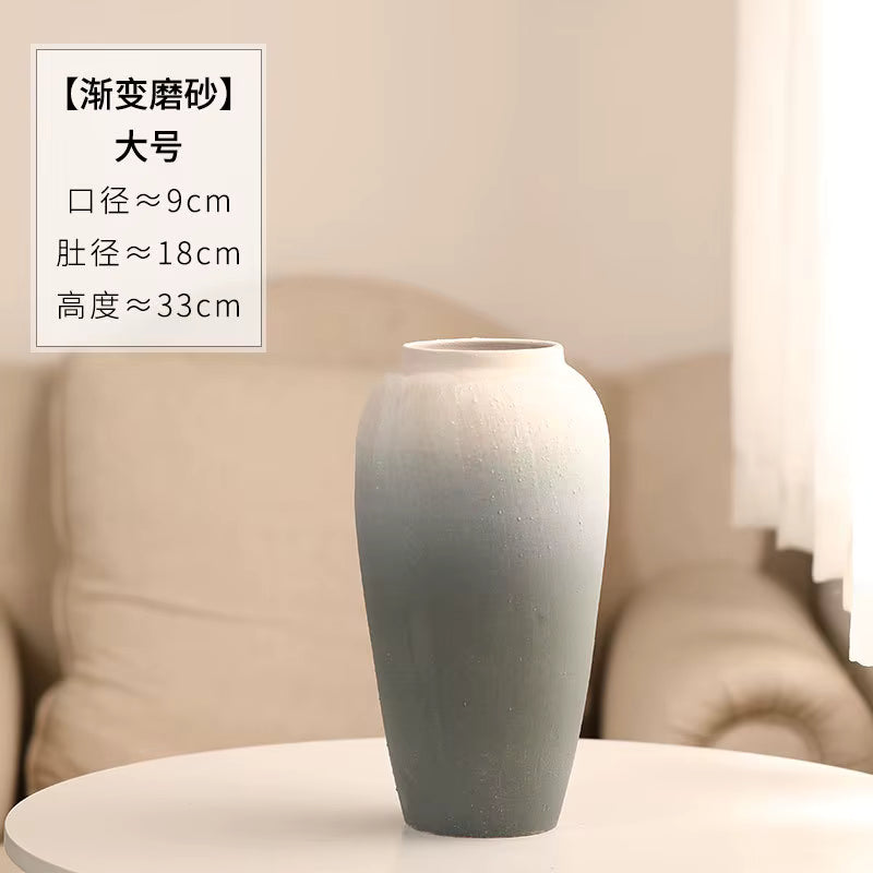 Gray gradient vase on a table with text overlay in a room setting