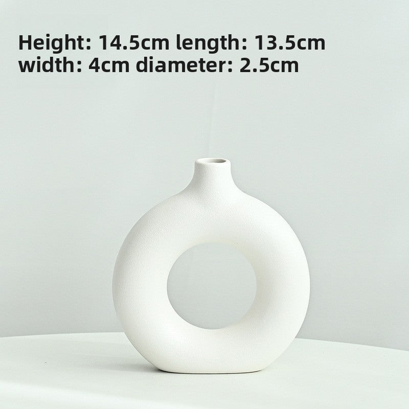 White vase on a light gray background with dimensions displayed